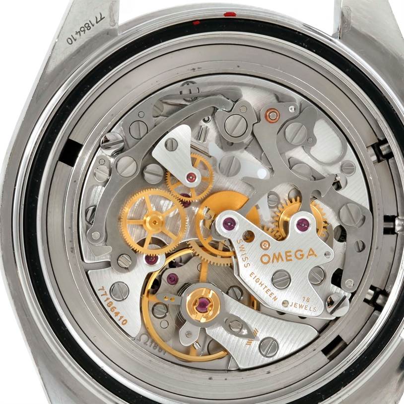 This image shows the intricate internal mechanism of the Omega Speedmaster 3570.50.00 Men
s Stainless Steel Black Dial 3570.50.00 Men
s Stainless Steel Black Dial watch from a back view, revealing gears and jewels.
