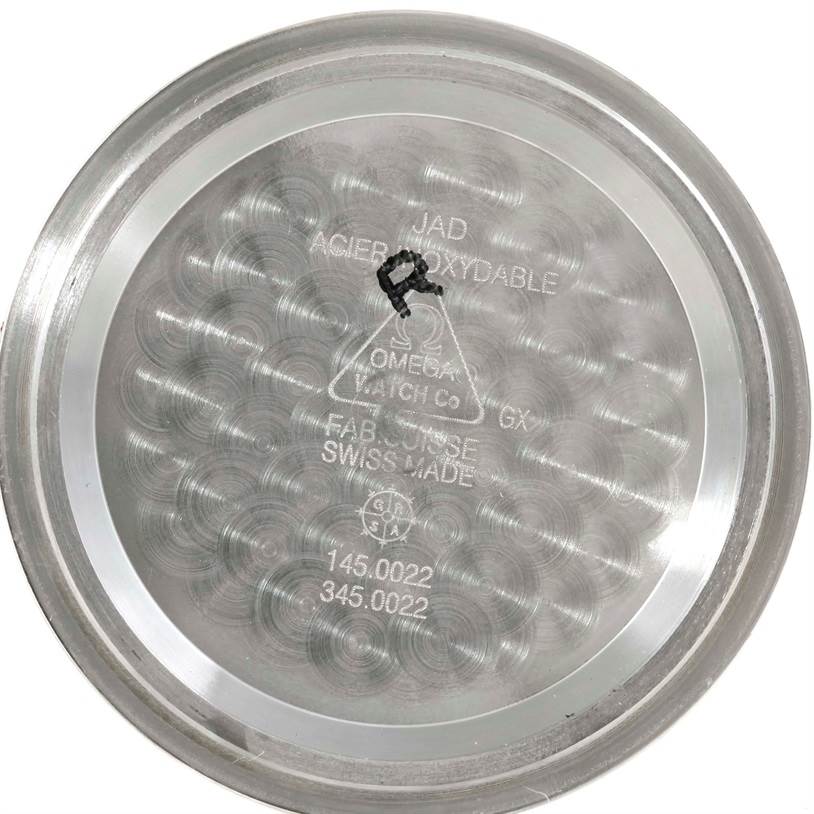 This image shows the inner case back of an Omega Speedmaster 3570.50.00 Men
s Stainless Steel Black Dial 3570.50.00 Men
s Stainless Steel Black Dial watch, displaying model numbers and manufacturing details.