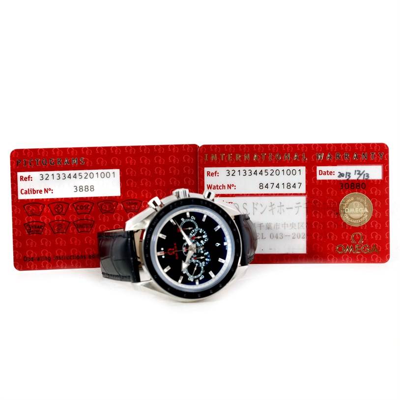 The Omega Speedmaster 321.33.44.52.01.001 Men
s Stainless Steel Black Dial 321.33.44.52.01.001 Men
s Stainless Steel Black Dial watch is displayed at a slight angle with its certification cards behind it.