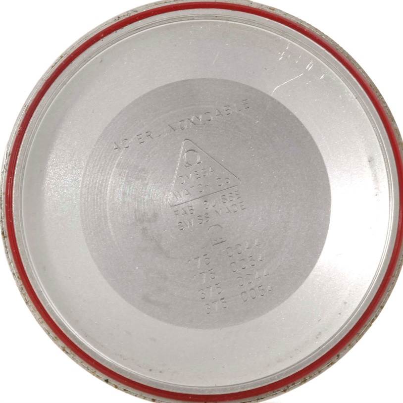 The image shows the inside case back of an Omega Speedmaster 3523.30.00 Men
s Stainless Steel Silver Dial 3523.30.00 Men
s Stainless Steel Silver Dial watch viewed from a direct top-down angle.