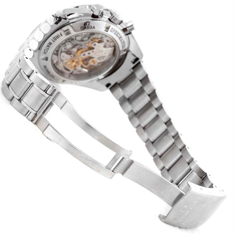 The image shows the rear view of an Omega Speedmaster 3572.50.00 Men
s Stainless Steel Black Dial 3572.50.00 Men
s Stainless Steel Black Dial watch, highlighting its open case back and metal bracelet.