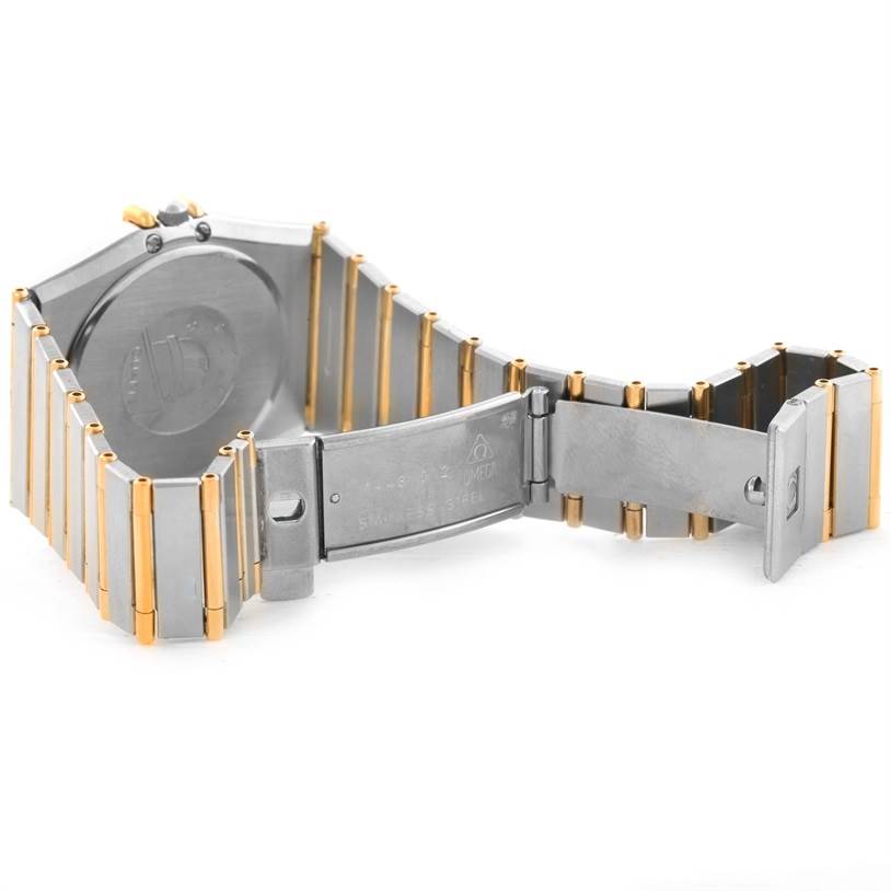 This image shows the open bracelet and clasp of a Constellation model by Omega, focusing on the back and the link details.