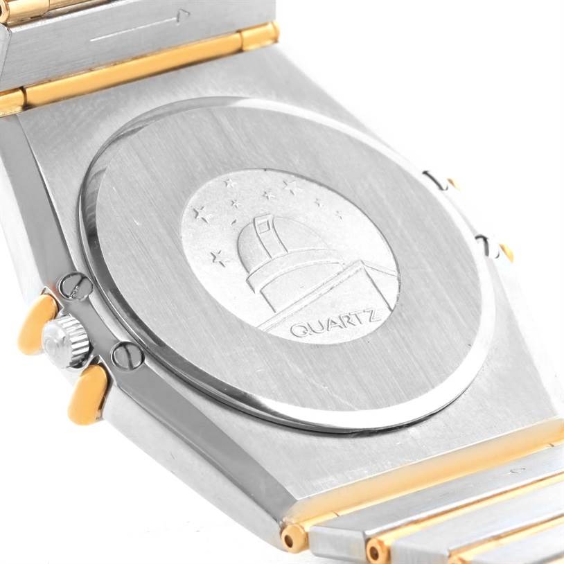 The image shows the back case and part of the bracelet of an Omega Constellation Men's Steel and Gold (two tone) Black Dial Men's Steel and Gold (two tone) Black Dial Quartz watch, viewed at an angle.