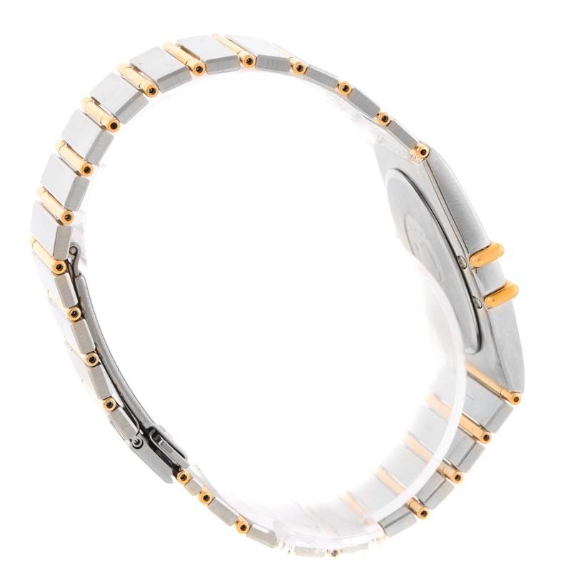 The image shows a side view of an Omega Constellation Men's Steel and Gold (two tone) Black Dial Men's Steel and Gold (two tone) Black Dial watch, focusing on the band and the case.