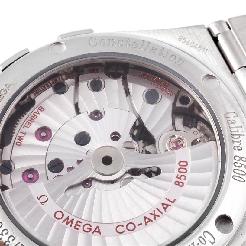 The image shows the back view of an Omega Constellation 123.10.38.21.01.002 Men's Stainless Steel Black Dial 123.10.38.21.01.002 Men's Stainless Steel Black Dial watch, specifically the inner mechanical parts and "Calibre 8500" inscribed.