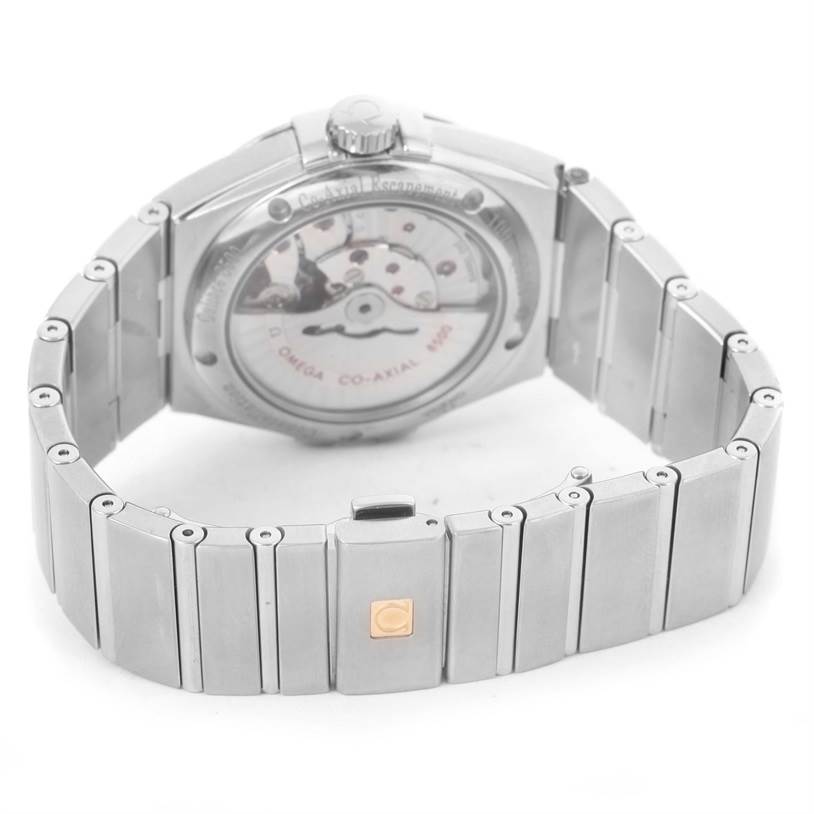 The image shows the back view of the Omega Constellation 123.10.38.21.01.002 Men's Stainless Steel Black Dial 123.10.38.21.01.002 Men's Stainless Steel Black Dial watch, focusing on the bracelet and exposed movement.