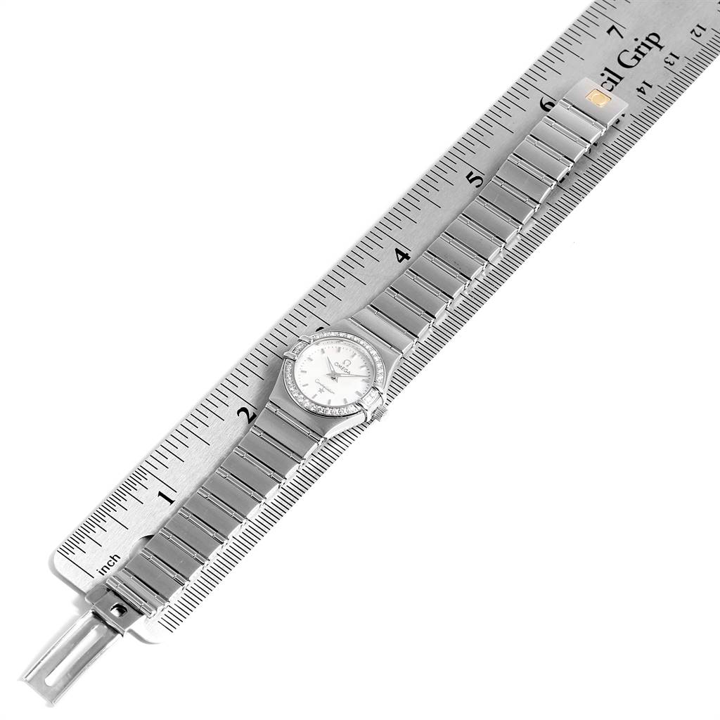 The Omega Constellation 1466.71.00 Women's Stainless Steel Mother of Pearl Dial 1466.71.00 Women's Stainless Steel Mother of Pearl Dial watch is shown from an overhead angle, with the entire bracelet and face visible alongside a ruler.