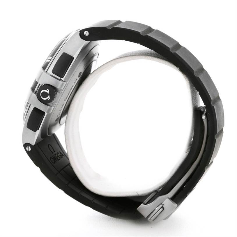 The image shows a side view of an Omega Constellation 121.92.41.50.01.001 Men's Titanium Black Dial 121.92.41.50.01.001 Men's Titanium Black Dial watch, highlighting the crown and rubber strap.