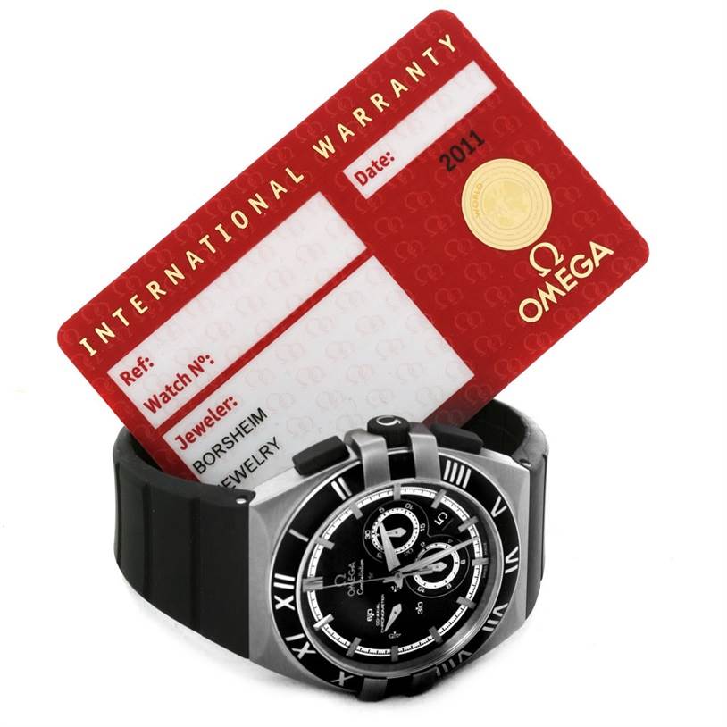 The image shows the face and bezel of an Omega Constellation 121.92.41.50.01.001 Men's Titanium Black Dial 121.92.41.50.01.001 Men's Titanium Black Dial watch along with its International Warranty card.