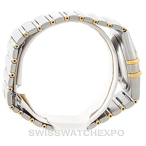 The image shows a side view of an Omega Constellation 1302.30.00 Men's Steel and Gold (two tone) Silver Dial 1302.30.00 Men's Steel and Gold (two tone) Silver Dial watch, highlighting its bracelet and case with gold accents.