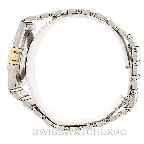 This side view of the Omega Constellation 1202.30.00 Men's Steel and Gold (two tone) Silver Dial 1202.30.00 Men's Steel and Gold (two tone) Silver Dial watch shows its bracelet and clasp with a clear profile of the case.