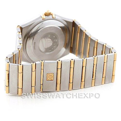 The image shows the back of the Omega Constellation 1202.30.00 Men's Steel and Gold (two tone) Silver Dial 1202.30.00 Men's Steel and Gold (two tone) Silver Dial watch, highlighting the case back and the metal bracelet with gold accents.