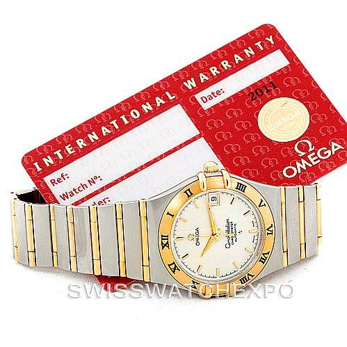 The image shows an Omega Constellation 1202.30.00 Men's Steel and Gold (two tone) Silver Dial 1202.30.00 Men's Steel and Gold (two tone) Silver Dial watch from a front angle with an International Warranty card placed behind it.