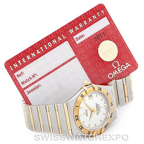 The image shows an Omega Constellation 1202.30.00 Men
s Steel and Gold (two tone) Silver Dial 1202.30.00 Men
s Steel and Gold (two tone) Silver Dial watch and its international warranty card, with both items displayed from a top-down angle.