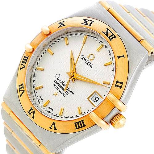 The image shows an Omega Constellation 1202.30.00 Men's Steel and Gold (two tone) Silver Dial 1202.30.00 Men's Steel and Gold (two tone) Silver Dial watch angled to display the face, bezel, and parts of the bracelet.