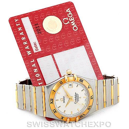 This image shows an Omega Constellation 1202.30.00 Men's Steel and Gold (two tone) Silver Dial 1202.30.00 Men's Steel and Gold (two tone) Silver Dial watch placed flat, accompanied by its red warranty card.