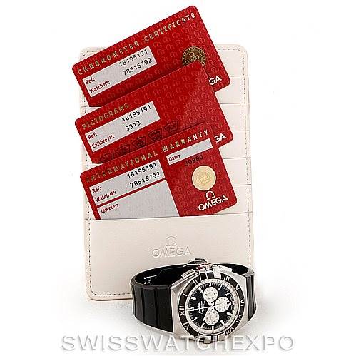 The image shows an Omega Constellation 1819.51.91 Men's Stainless Steel Black Dial 1819.51.91 Men's Stainless Steel Black Dial watch with a black strap, placed in front of its warranty cards and certificate.