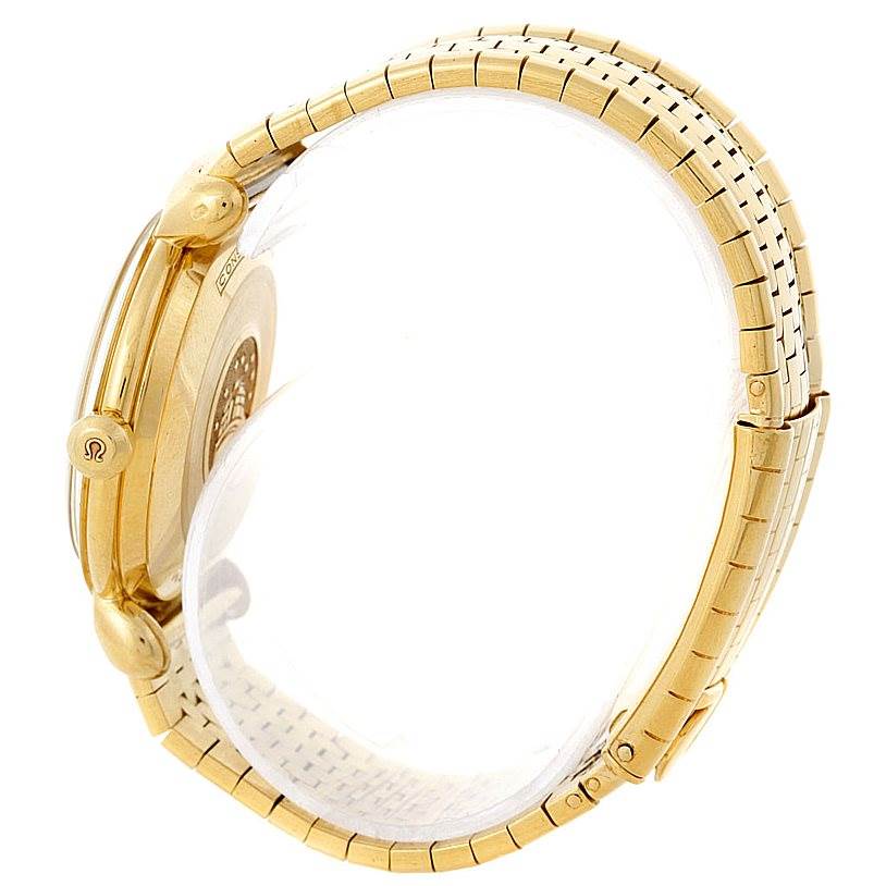 The image shows a side view of an Omega Constellation 14365 Men's Yellow Gold Champagne Dial 14365 Men's Yellow Gold Champagne Dial watch, highlighting its gold case, crown, and bracelet.