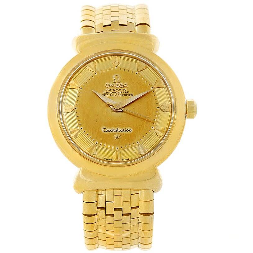 The image shows a frontal view of an Omega Constellation 14365 Men's Yellow Gold Champagne Dial 14365 Men's Yellow Gold Champagne Dial watch, highlighting its gold-colored dial, bezel, and bracelet.