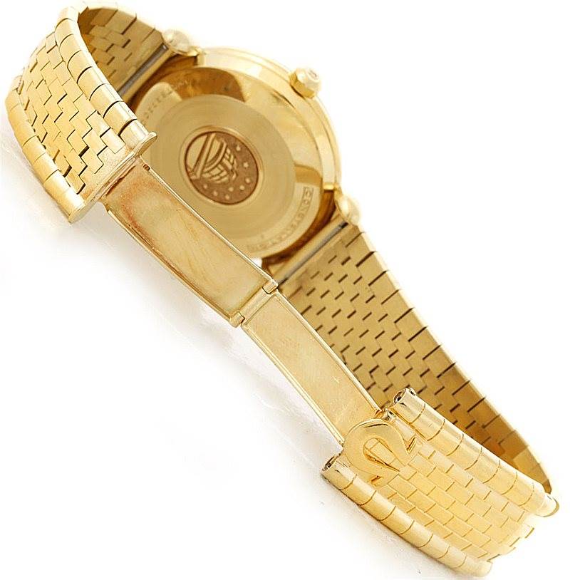 This image shows the back case and the gold bracelet of an Omega Constellation 14365 Men's Yellow Gold Champagne Dial 14365 Men's Yellow Gold Champagne Dial watch.