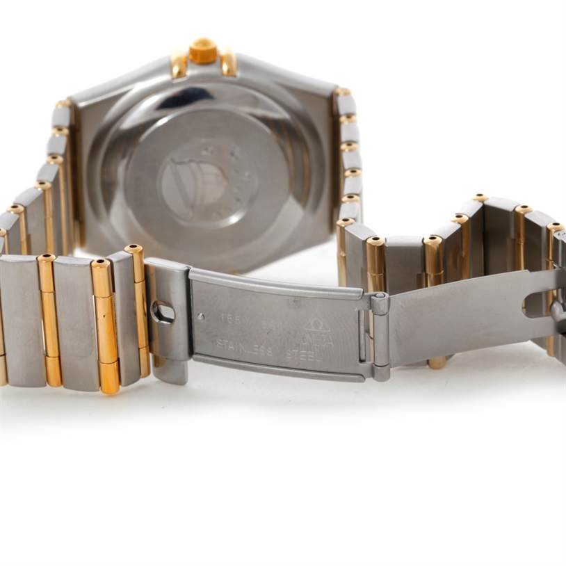 The image shows the back and clasp of the Omega Constellation 1202.30.00 Men
s Steel and Gold (two tone) Silver Dial 1202.30.00 Men
s Steel and Gold (two tone) Silver Dial watch, highlighting its stainless steel and gold bracelet.