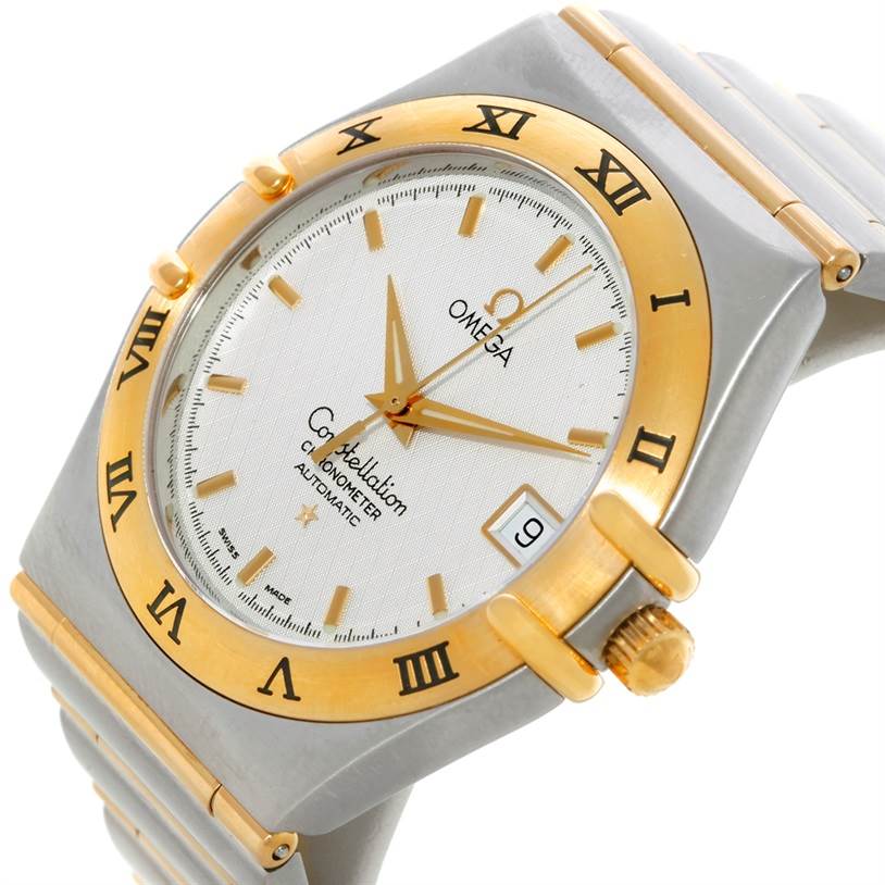 This image shows the Omega Constellation 1202.30.00 Men
s Steel and Gold (two tone) Silver Dial 1202.30.00 Men
s Steel and Gold (two tone) Silver Dial watch from a slight side angle, emphasizing the face, bezel, and part of the bracelet.