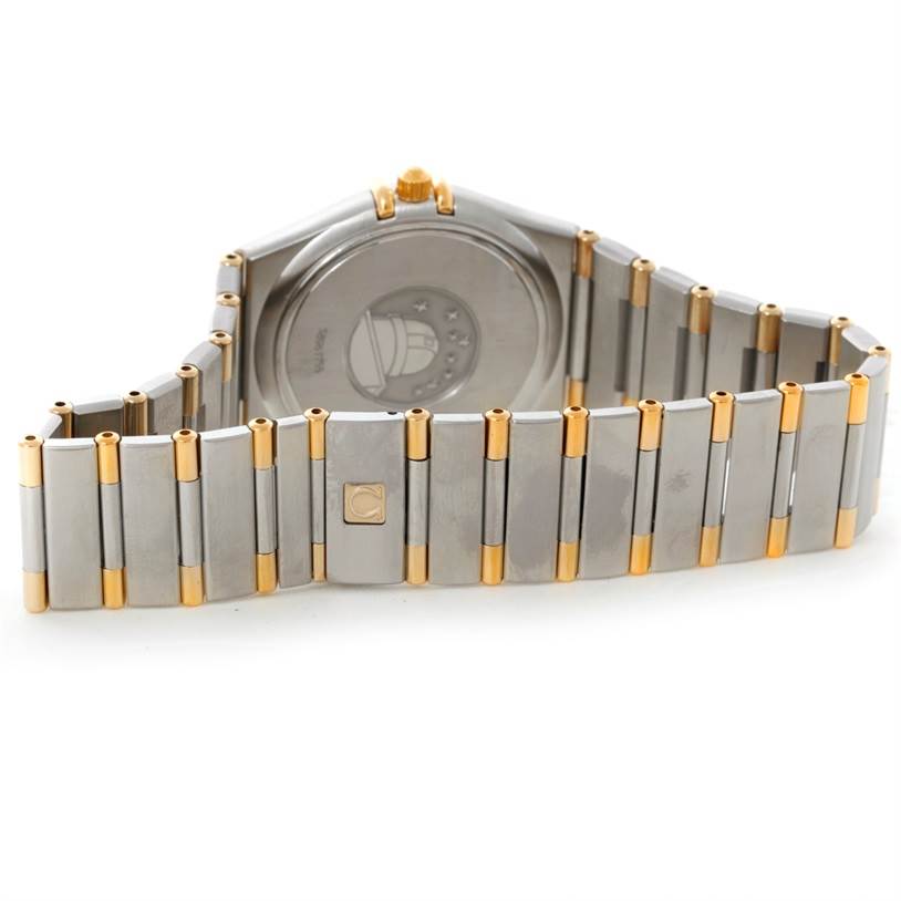 The image shows the back view of an Omega Constellation 1312.30.00 Men's Steel and Gold (two tone) Silver Dial 1312.30.00 Men's Steel and Gold (two tone) Silver Dial watch, focusing on the case back and part of the bracelet.