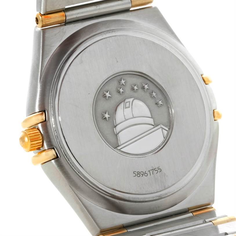 The image shows the back case of the Omega Constellation 1312.30.00 Men's Steel and Gold (two tone) Silver Dial 1312.30.00 Men's Steel and Gold (two tone) Silver Dial watch, featuring an engraved observatory logo and the crown on the side.