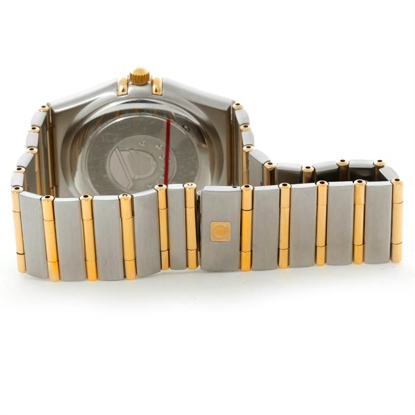The image shows the back view of an Omega Constellation 1252.30.00 Men's Steel and Gold (two tone) Silver Dial 1252.30.00 Men's Steel and Gold (two tone) Silver Dial watch with its case back and bi-color bracelet visible.
