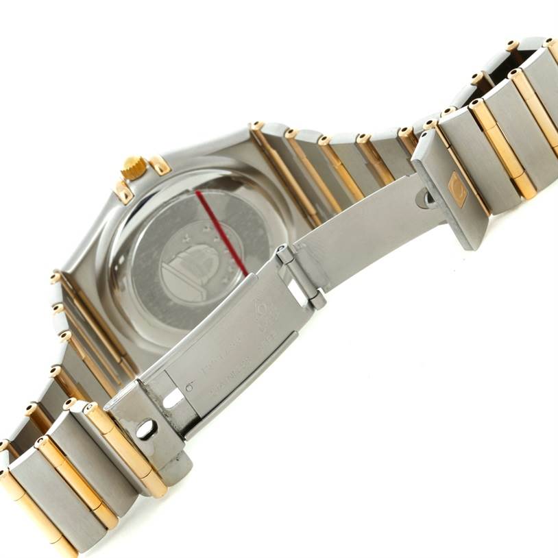 The image shows the back and bracelet clasp of an Omega Constellation 1252.30.00 Men's Steel and Gold (two tone) Silver Dial 1252.30.00 Men's Steel and Gold (two tone) Silver Dial watch, highlighting its two-tone metal design.