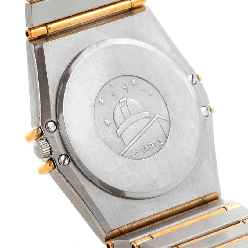 This image shows the case back and part of the bracelet of an Omega Constellation Men's Steel and Gold (two tone) Champagne Dial Men's Steel and Gold (two tone) Champagne Dial Quartz watch.