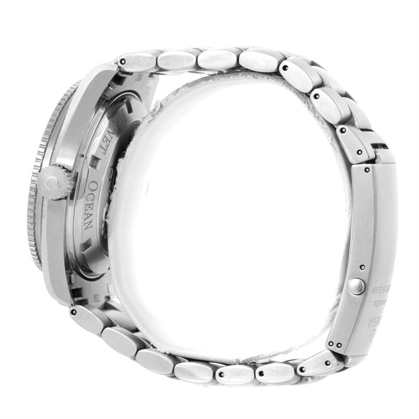 The image shows a side view of an Omega Planet Ocean 2201.50.00 Men
s Stainless Steel Black Dial 2201.50.00 Men
s Stainless Steel Black Dial watch, focusing on the case back and metal bracelet.