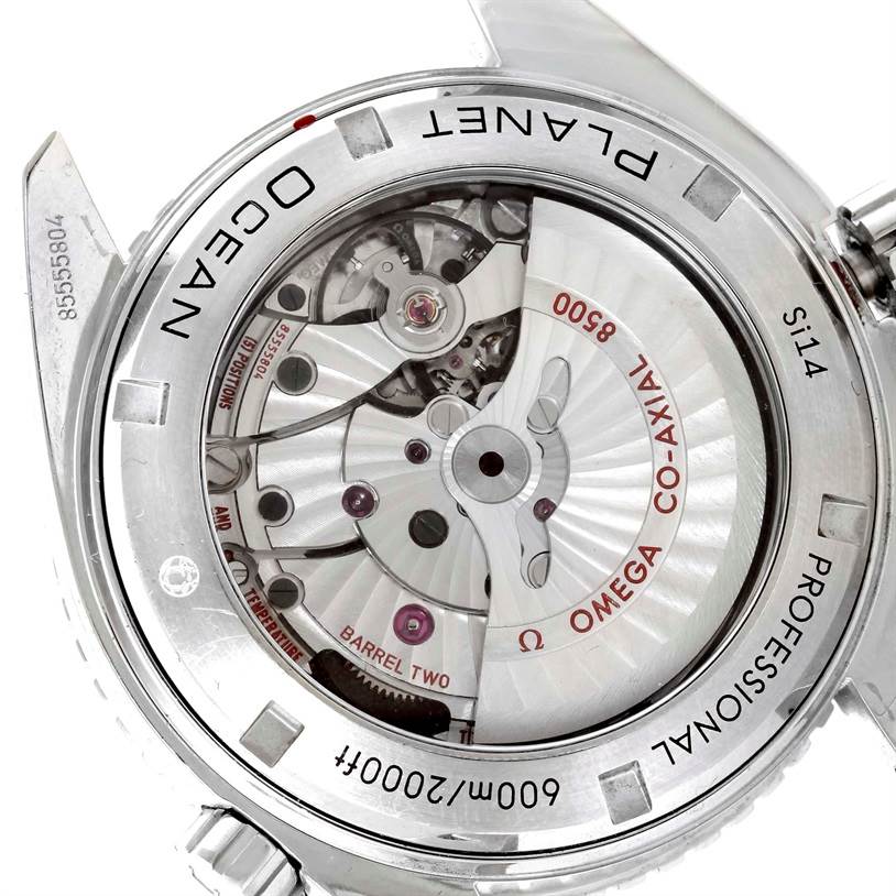 The image shows the back view of the Omega Planet Ocean 232.30.46.21.01.003 Men
s Stainless Steel Black Dial 232.30.46.21.01.003 Men
s Stainless Steel Black Dial watch, revealing its internal mechanical parts and co-axial movement.