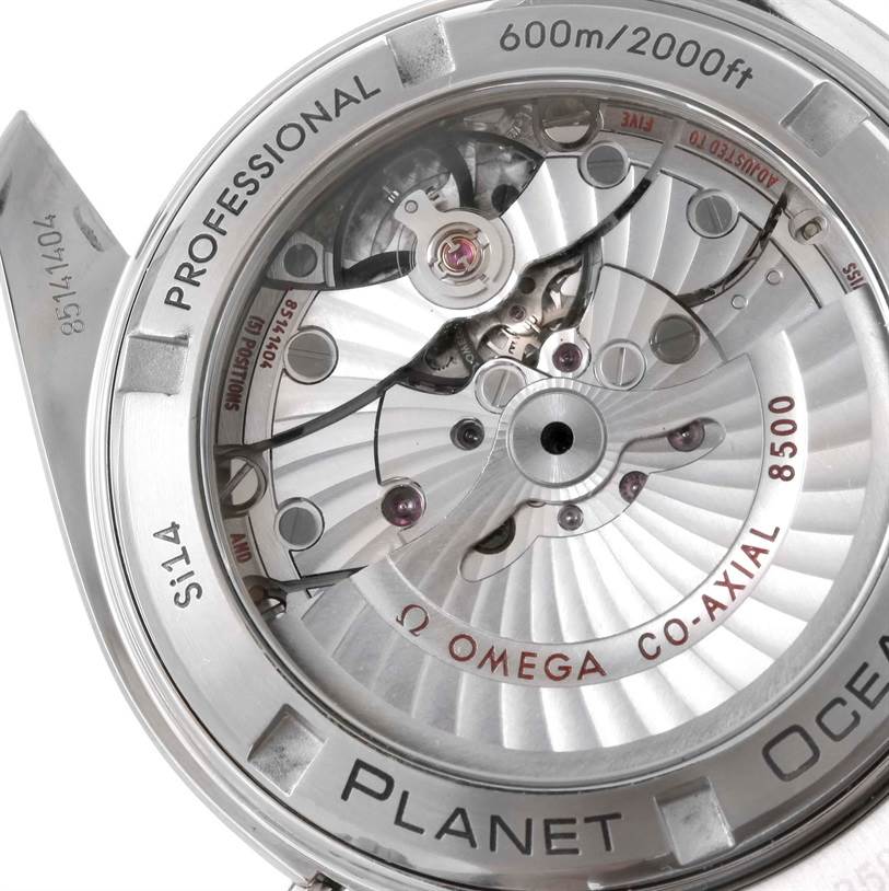The image shows the back of the Omega Planet Ocean 232.15.42.21.04.001 Men's Stainless Steel White Dial 232.15.42.21.04.001 Men's Stainless Steel White Dial watch, highlighting its Co-Axial 8500 movement and casing details.