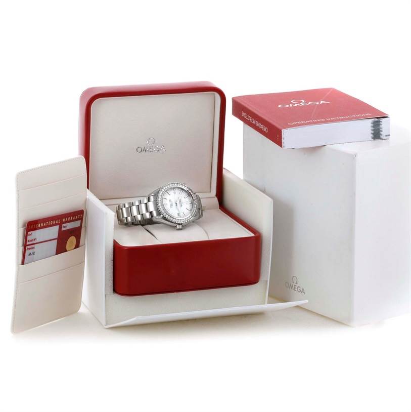 The image shows an Omega Planet Ocean 232.15.42.21.04.001 Men's Stainless Steel White Dial 232.15.42.21.04.001 Men's Stainless Steel White Dial watch with a silver bracelet in its open red and white box alongside the warranty card and instruction manual.