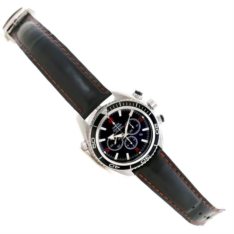 The Omega Planet Ocean 2210.51.00 Men
s Stainless Steel Black Dial 2210.51.00 Men
s Stainless Steel Black Dial watch is shown at an angled top view, displaying the face, bezel, case, and leather strap.