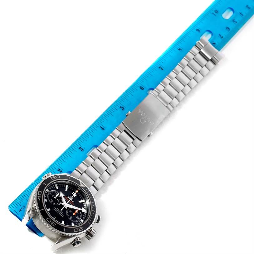 The image shows an overhead view of an Omega Planet Ocean 232.30.46.51.01.001 Men
s Stainless Steel Black Dial 232.30.46.51.01.001 Men
s Stainless Steel Black Dial watch, featuring its face, stainless steel bracelet, and clasp.