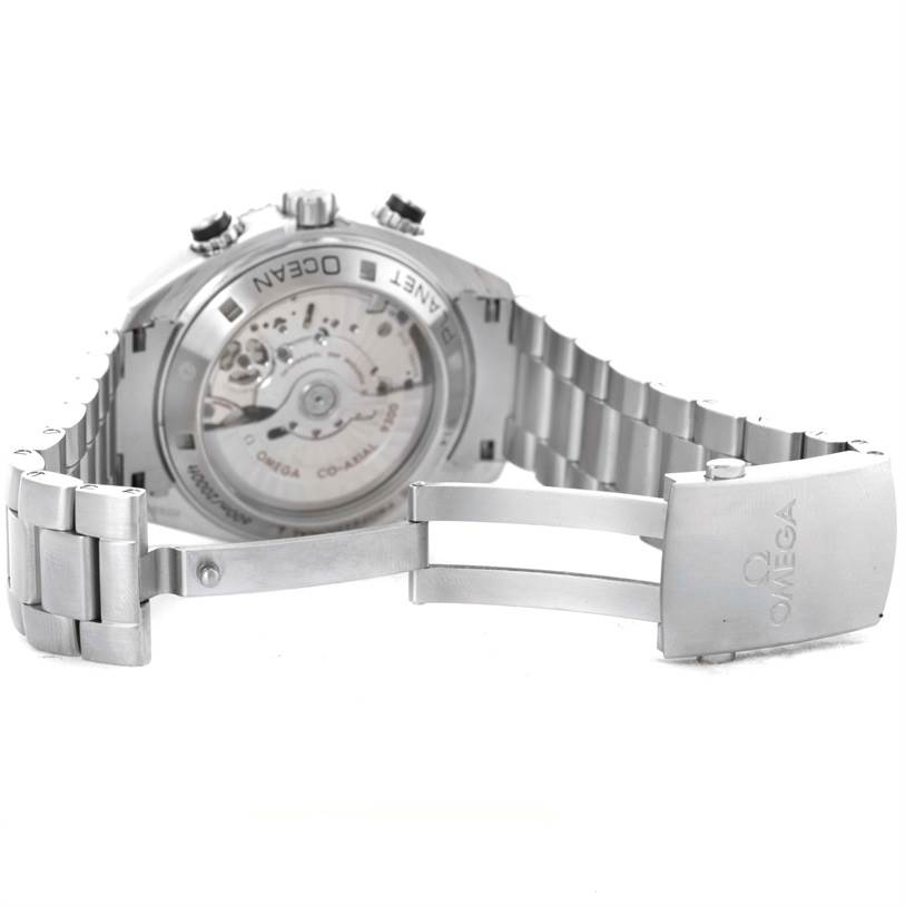 The image shows the back and side angles of an Omega Planet Ocean 232.30.46.51.01.001 Men
s Stainless Steel Black Dial 232.30.46.51.01.001 Men
s Stainless Steel Black Dial watch, highlighting its open clasp and transparent case back.