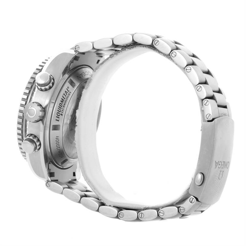 The image shows a side and back view of the Omega Planet Ocean 232.90.46.51.03.001 Men
s Titanium Blue Dial 232.90.46.51.03.001 Men
s Titanium Blue Dial watch, focusing on the case back, crown, and metal bracelet.