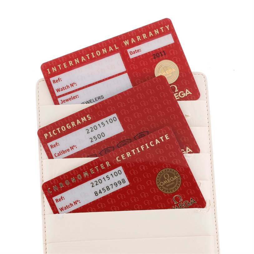 The image shows the warranty, pictograms, and chronometer certificate cards for the Omega Planet Ocean 2201.51.00 Men
s Stainless Steel Black Dial 2201.51.00 Men
s Stainless Steel Black Dial watch.