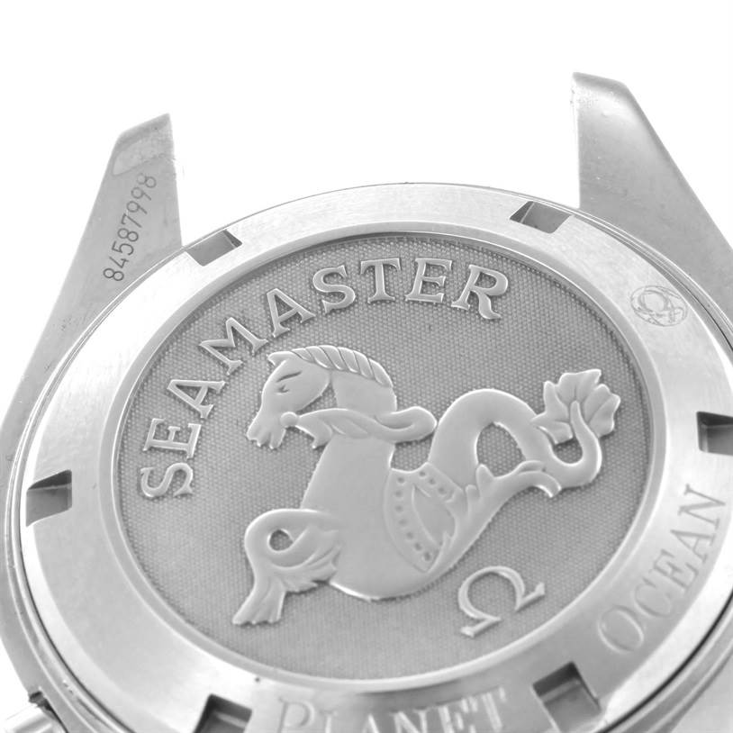 This image shows the back case of an Omega Planet Ocean 2201.51.00 Men
s Stainless Steel Black Dial 2201.51.00 Men
s Stainless Steel Black Dial Seamaster watch, focusing on its embossed seahorse design and model engravings.