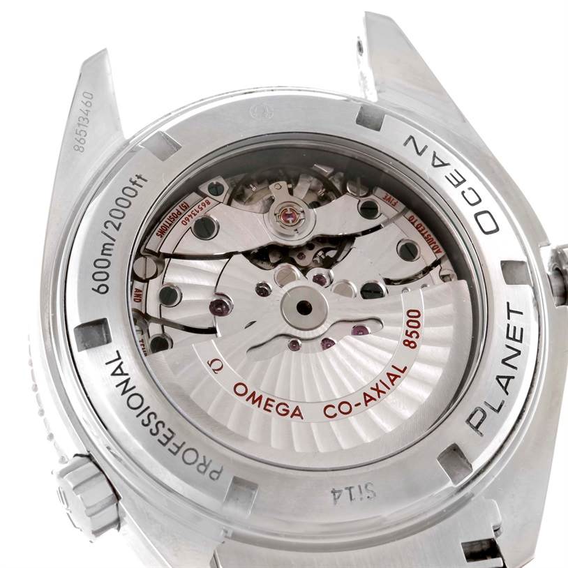 The image shows the back of an Omega Planet Ocean 232.30.46.21.01.003 Men's Stainless Steel Black Dial 232.30.46.21.01.003 Men's Stainless Steel Black Dial watch, highlighting its Co-Axial 8500 movement and water-resistant features.