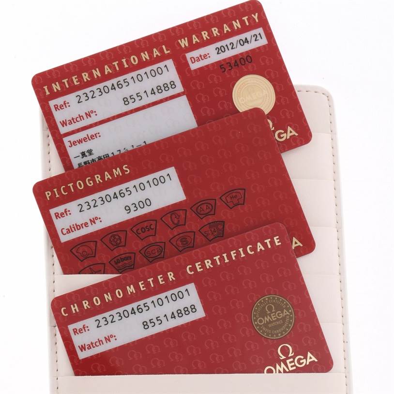 The image shows the international warranty, pictograms, and chronometer certificate cards for an Omega Planet Ocean 232.30.46.51.01.001 Men
s Stainless Steel Black Dial 232.30.46.51.01.001 Men
s Stainless Steel Black Dial watch.