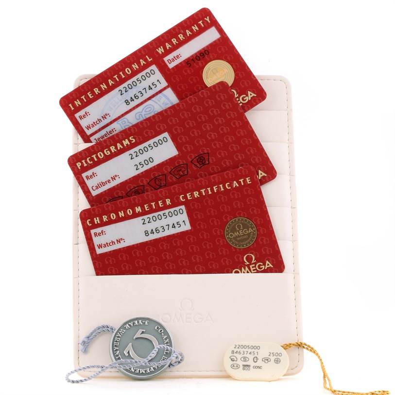 The image shows warranty cards, a certification card, a pictograms card, and tags for the Omega Planet Ocean 2200.50.00 Men
s Stainless Steel Black Dial 2200.50.00 Men
s Stainless Steel Black Dial watch.