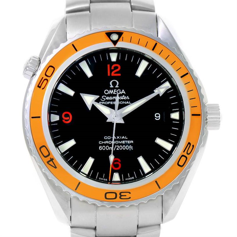 The image shows a front view of the Omega Planet Ocean model, highlighting its dial and orange bezel.