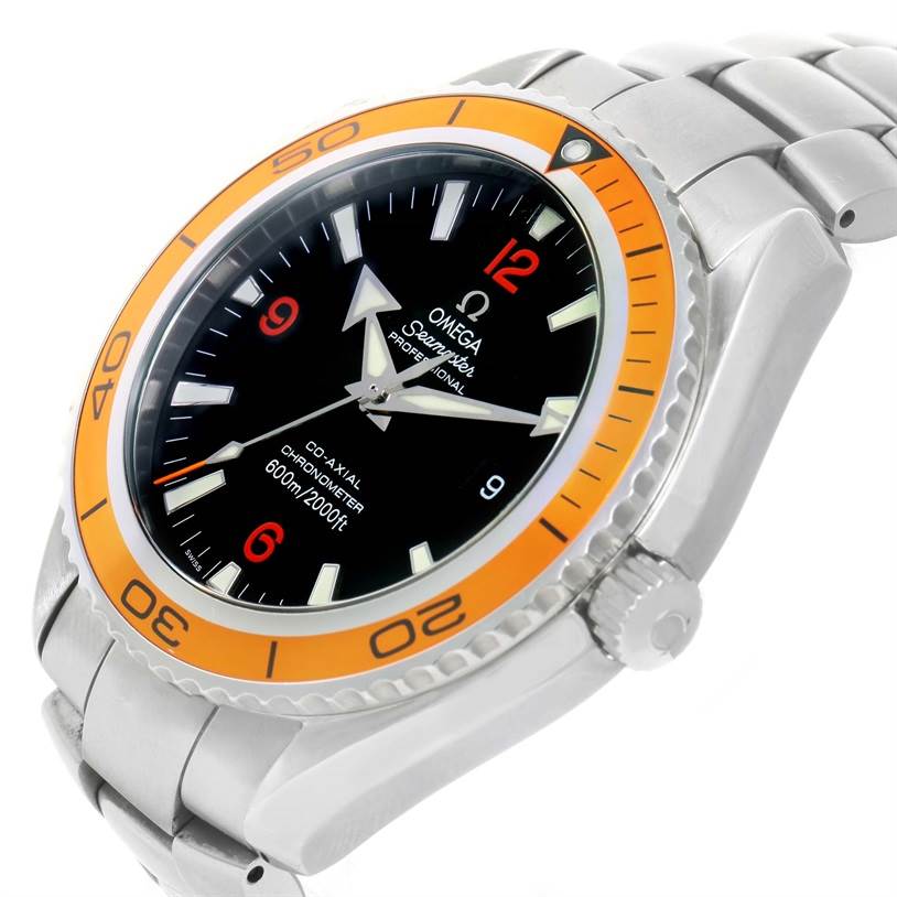 The image shows an angled view of the Omega Planet Ocean 2208.50.00 Men
s Stainless Steel Black Dial 2208.50.00 Men
s Stainless Steel Black Dial watch, highlighting the orange bezel, black dial, and stainless steel bracelet.