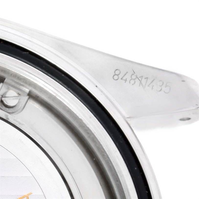 The image shows an angled close-up of the Omega Planet Ocean 2208.50.00 Men
s Stainless Steel Black Dial 2208.50.00 Men
s Stainless Steel Black Dial watch
s case back and lug, displaying part of the serial number.