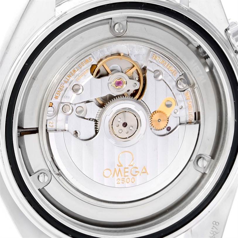 The image shows the back view of the Omega Planet Ocean 2208.50.00 Men
s Stainless Steel Black Dial 2208.50.00 Men
s Stainless Steel Black Dial watch, highlighting its movement mechanism and the engraved logo.