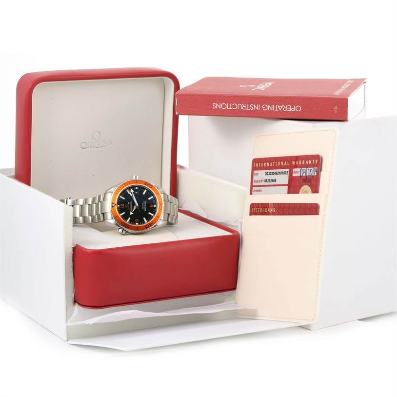 The image shows an Omega Planet Ocean 232.30.46.21.01.002 Men's Stainless Steel Black Dial 232.30.46.21.01.002 Men's Stainless Steel Black Dial watch in its box, alongside the international warranty card and operating instructions.