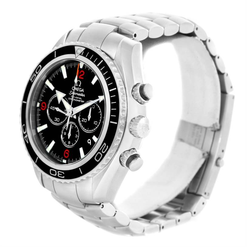 The image shows an angled view of an Omega Planet Ocean 2210.51.00 Men
s Stainless Steel Black Dial 2210.51.00 Men
s Stainless Steel Black Dial watch, highlighting the face, bezel, chronograph buttons, and bracelet.